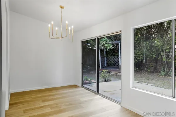 a view of a room with window wooden floor and garden