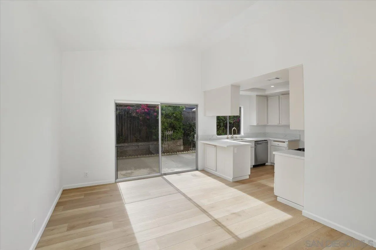 1708 Woodbridge Road Escondido, CA 92026 - Photo 22 of 38 a view of a kitchen with white cabinets and a stove