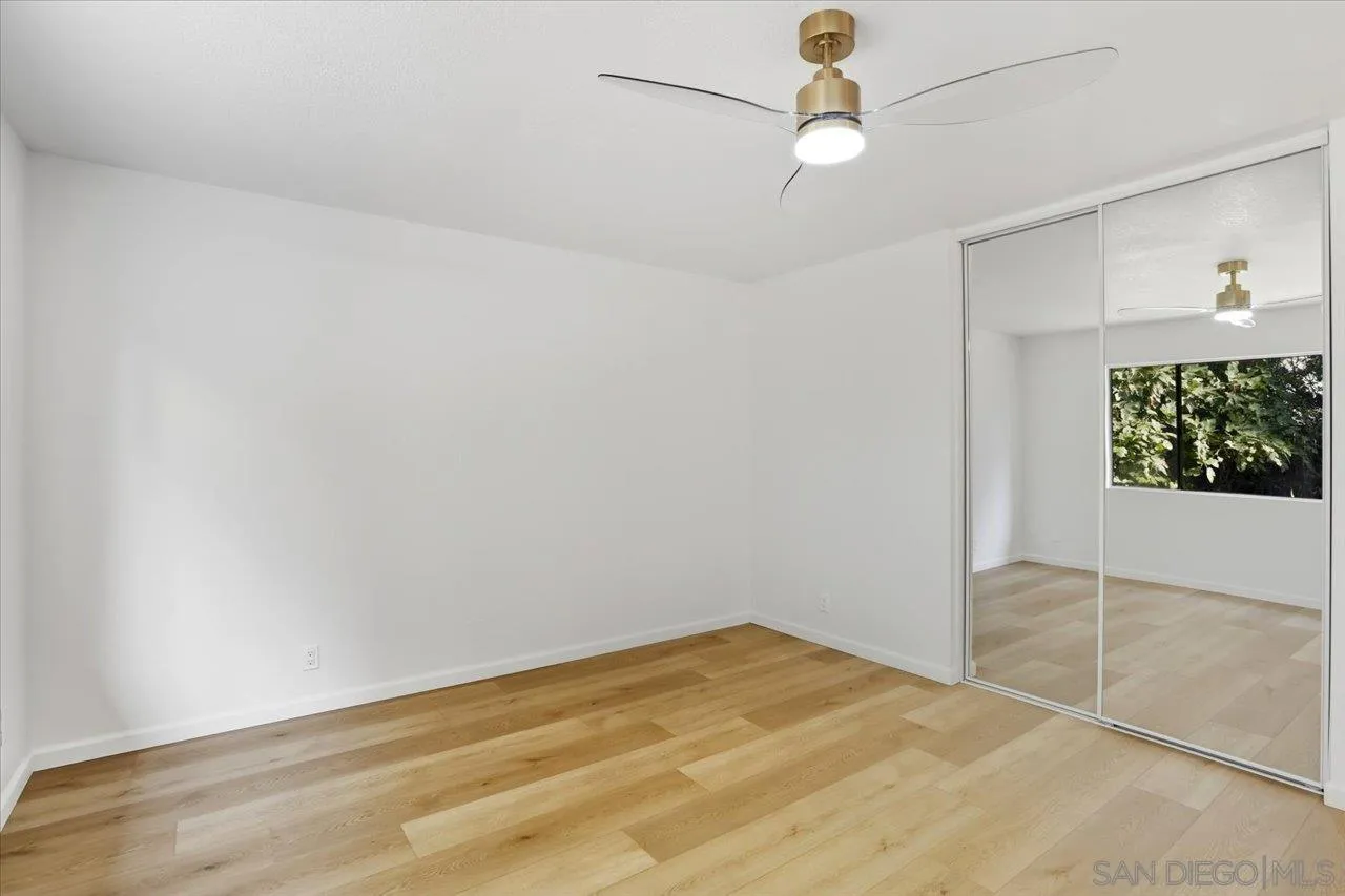 1708 Woodbridge Road Escondido, CA 92026 - Photo 25 of 38 an empty room with windows and fan