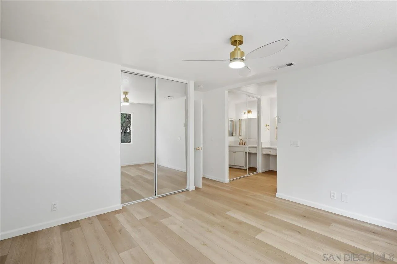 1708 Woodbridge Road Escondido, CA 92026 - Photo 26 of 38 a view of empty room with wooden floor and ceiling fan