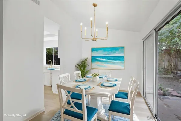 a view of a dining room with furniture window and outside view