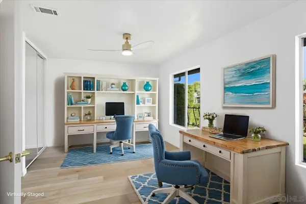 a view of a livingroom with furniture and a window