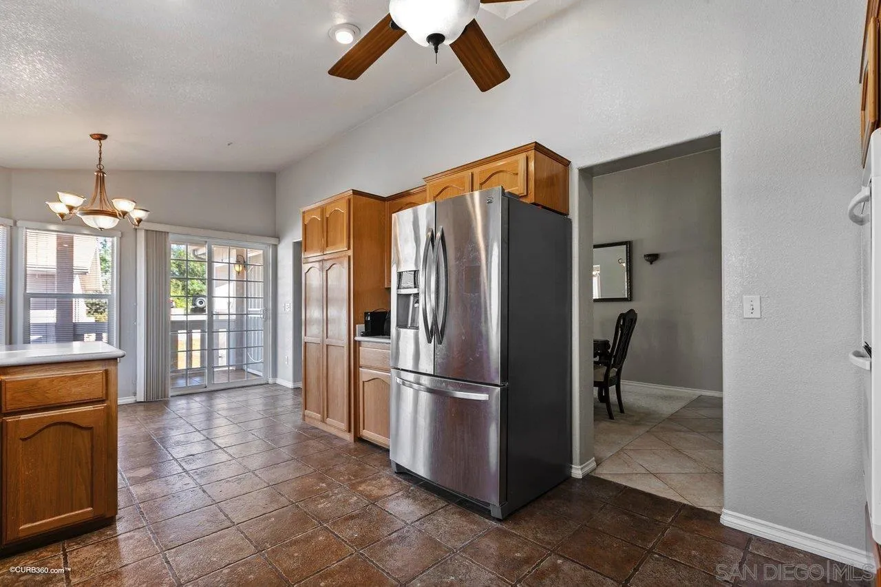 8622 Gardena Road Lakeside, CA 92040 - Photo 13 of 29 a kitchen with stainless steel appliances granite countertop a refrigerator and a sink