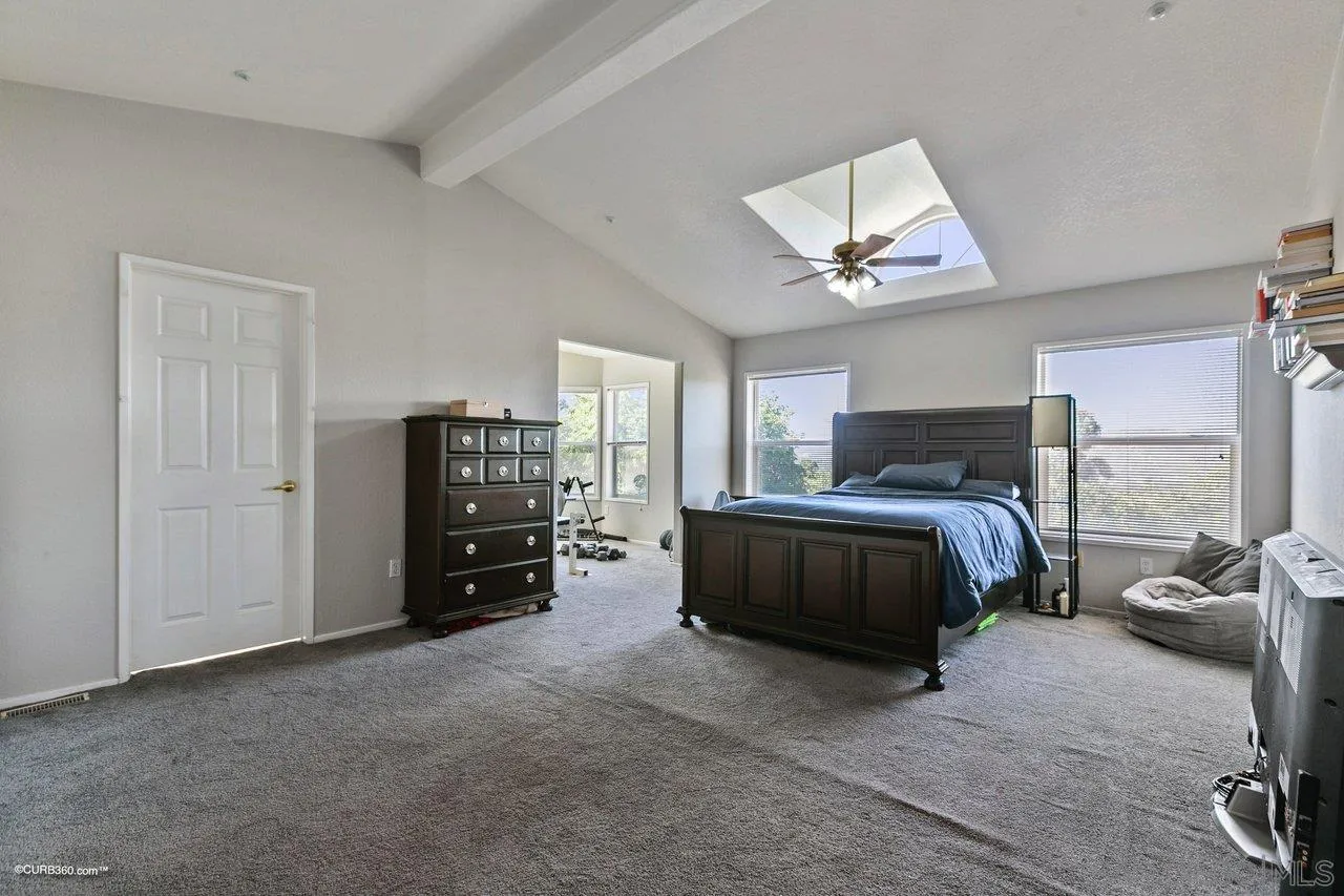 8622 Gardena Road Lakeside, CA 92040 - Photo 18 of 29 a bedroom with a bed and a tv