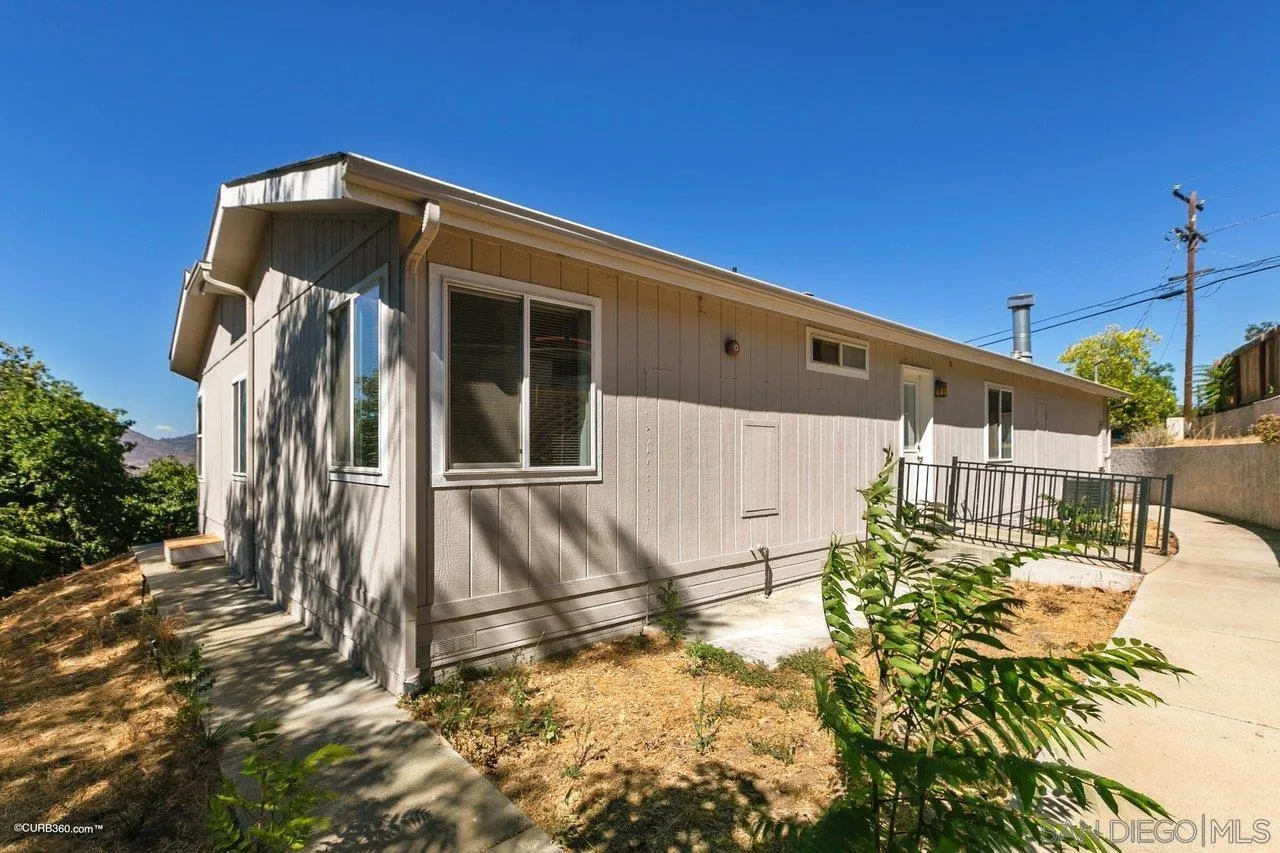 8622 Gardena Road Lakeside, CA 92040 - Photo 29 of 29 a front view of a house with a yard