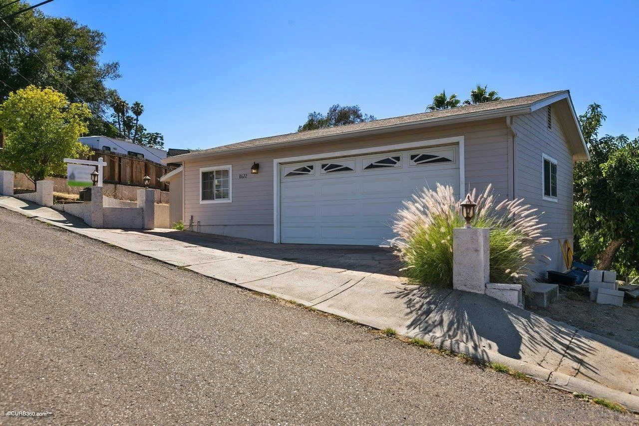 8622 Gardena Road Lakeside, CA 92040 - Photo 4 of 29 a view of a house with a yard and potted plants