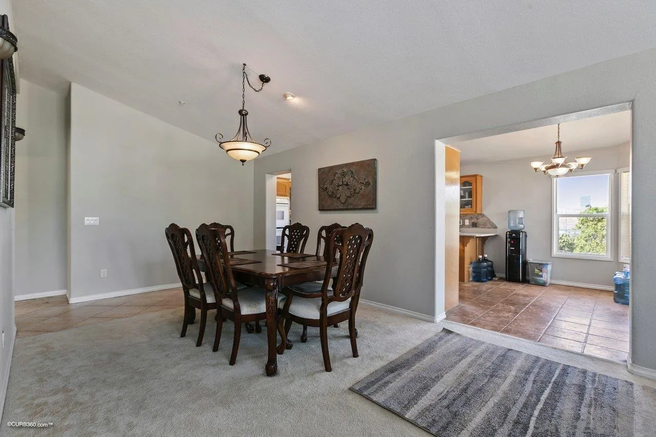 8622 Gardena Road Lakeside, CA 92040 - Photo 9 of 29 a view of a dining room with furniture and wooden floor