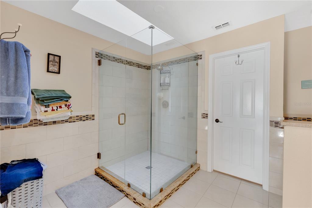 2640 Waymeyer Drive Orlando, FL 32812 - Photo 12 of 33 a bathroom with a shower and a sink