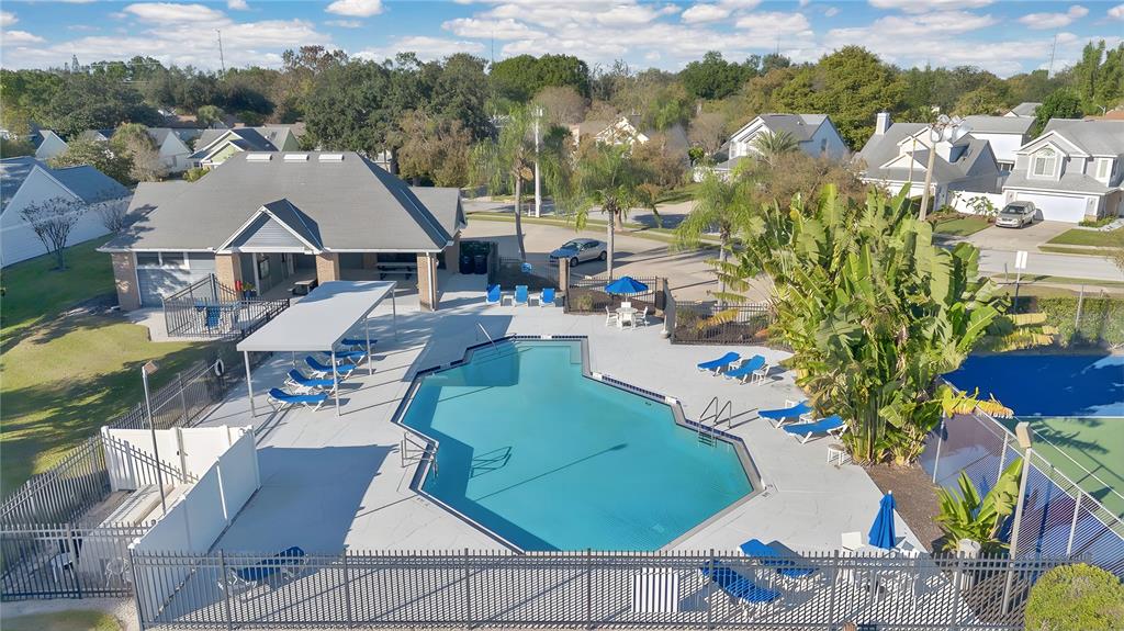 2640 Waymeyer Drive Orlando, FL 32812 - Photo 30 of 33 an aerial view of a house with swimming pool and lake view