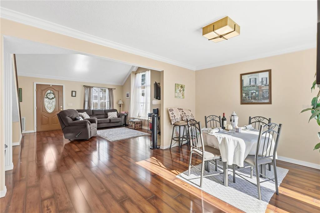 2640 Waymeyer Drive Orlando, FL 32812 - Photo 4 of 33 a view of a livingroom with furniture and a wooden floor