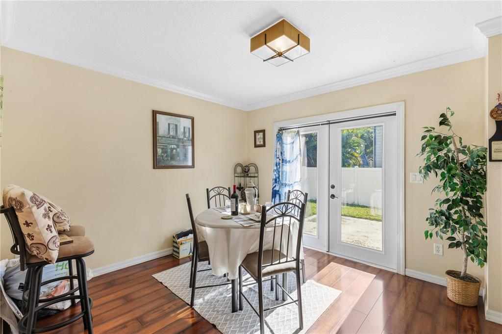 2640 Waymeyer Drive Orlando, FL 32812 - Photo 5 of 33 a view of a dining room with furniture and wooden floor
