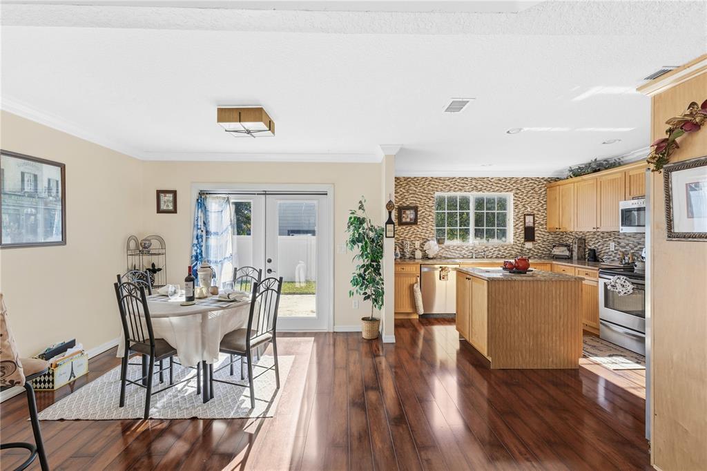 2640 Waymeyer Drive Orlando, FL 32812 - Photo 6 of 33 a living room with furniture and a wooden floor