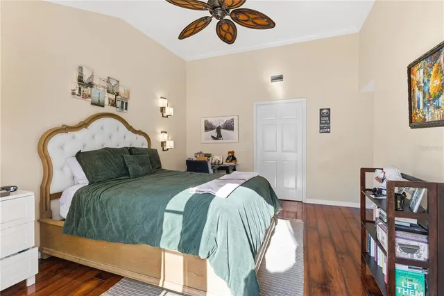 a bed room with a bed and a chandelier