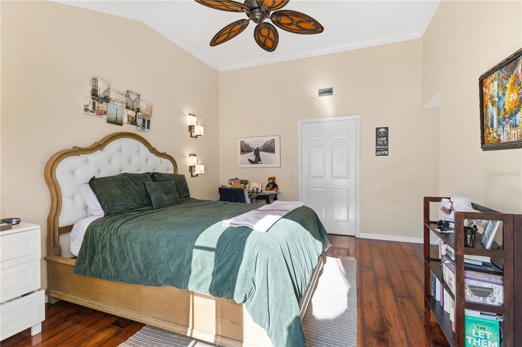 2640 Waymeyer Drive Orlando, FL 32812 - Photo 9 of 33 a bed room with a bed and a chandelier