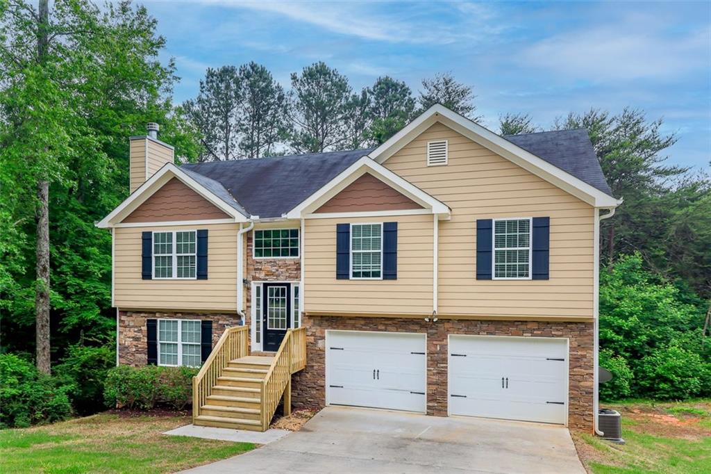 5719 Rocky Ridge Run Gainesville, GA 30506 - Photo 1 of 1 a view of house with yard and outdoor seating