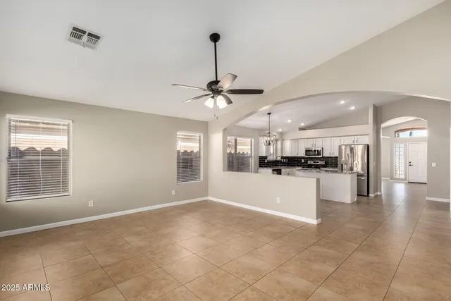 a view of a kitchen with a sink and microwave