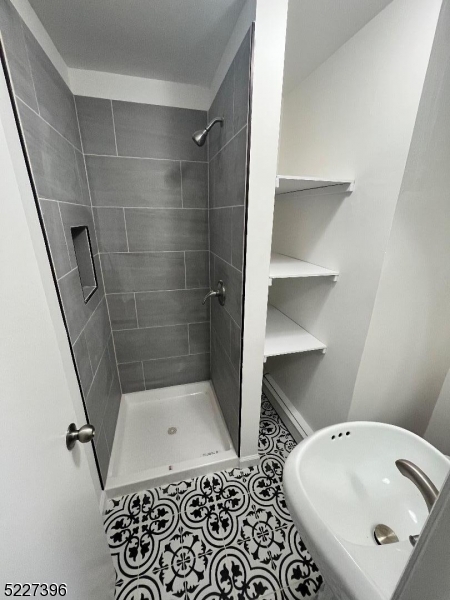 434 Richmond Street Elizabeth, NJ 07202 - Photo 2 of 5 a bathroom with a bathtub and shower