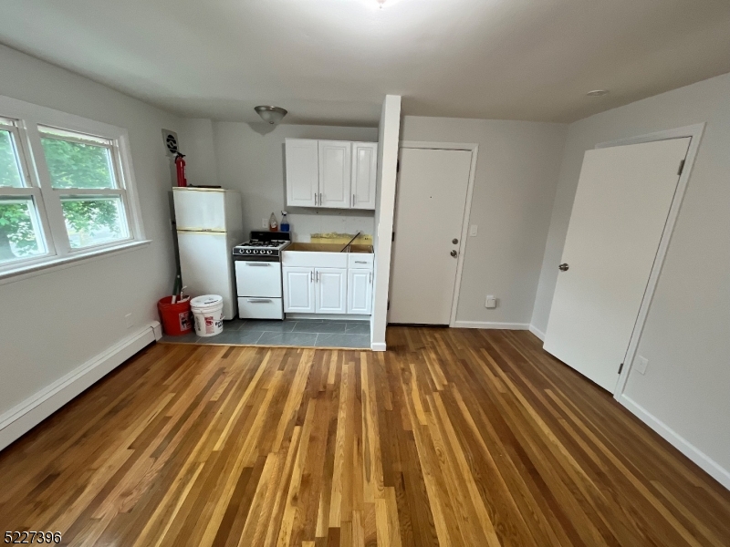 434 Richmond Street Elizabeth, NJ 07202 - Photo 3 of 5 a view of kitchen with sink and wooden floor