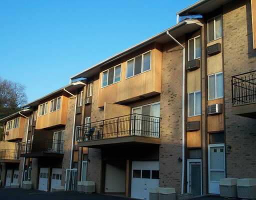 57 Rock Spring Road, Unit 13 Stamford, CT 06906 - Photo 1 of 1 a front view of a house with a balcony
