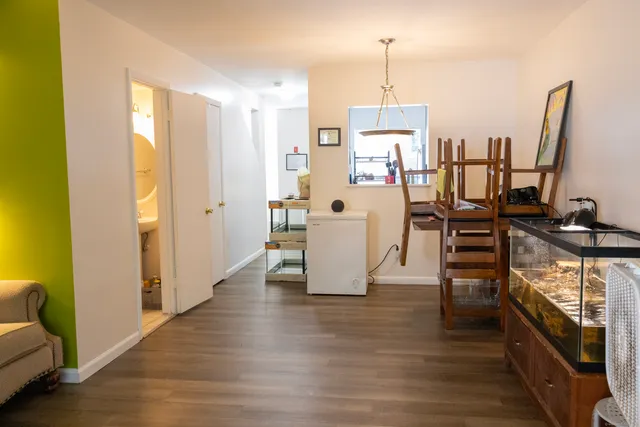 a view of kitchen with furniture and wooden floor