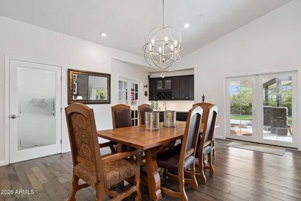 a view of a dining area with furniture and wooden floor