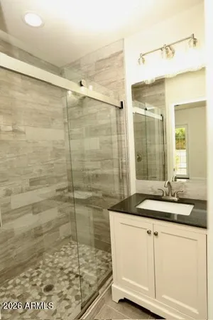 a living room with furniture dining table and a large window