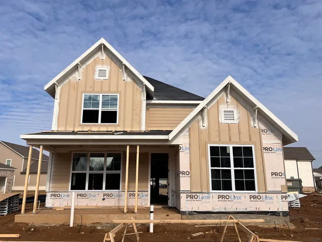 a view of a house with large windows
