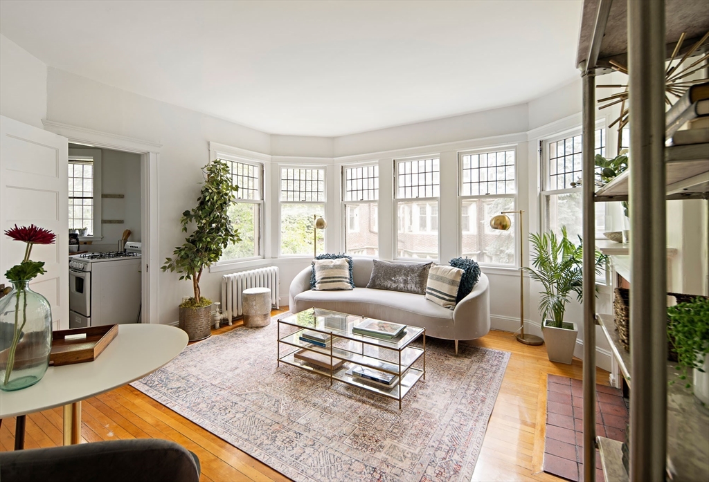 10 Dana Street, Unit 202 Cambridge, MA 02138 - Photo 2 of 16 a living room with furniture and a large window