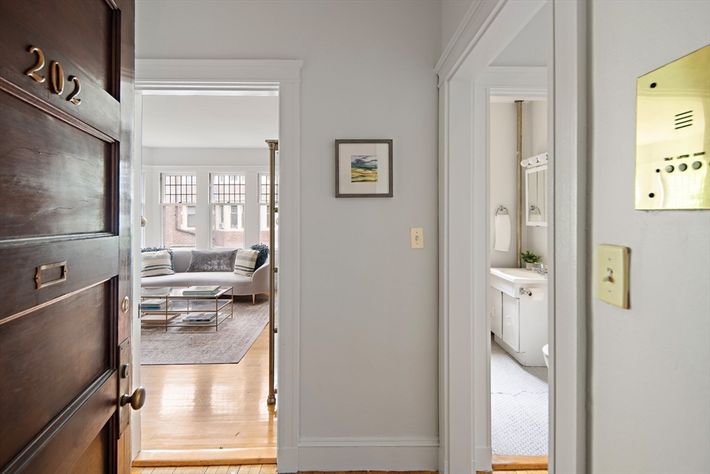 10 Dana Street, Unit 202 Cambridge, MA 02138 - Photo 5 of 16 a bathroom with a glass shower door