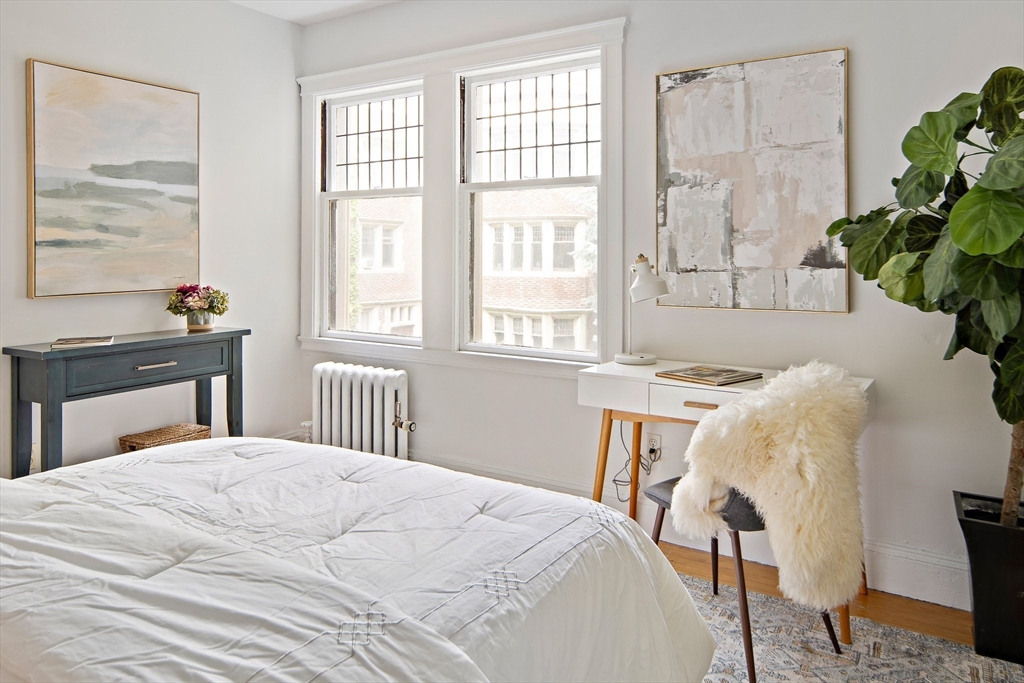 10 Dana Street, Unit 202 Cambridge, MA 02138 - Photo 10 of 16 a bedroom with a bed and a potted plant