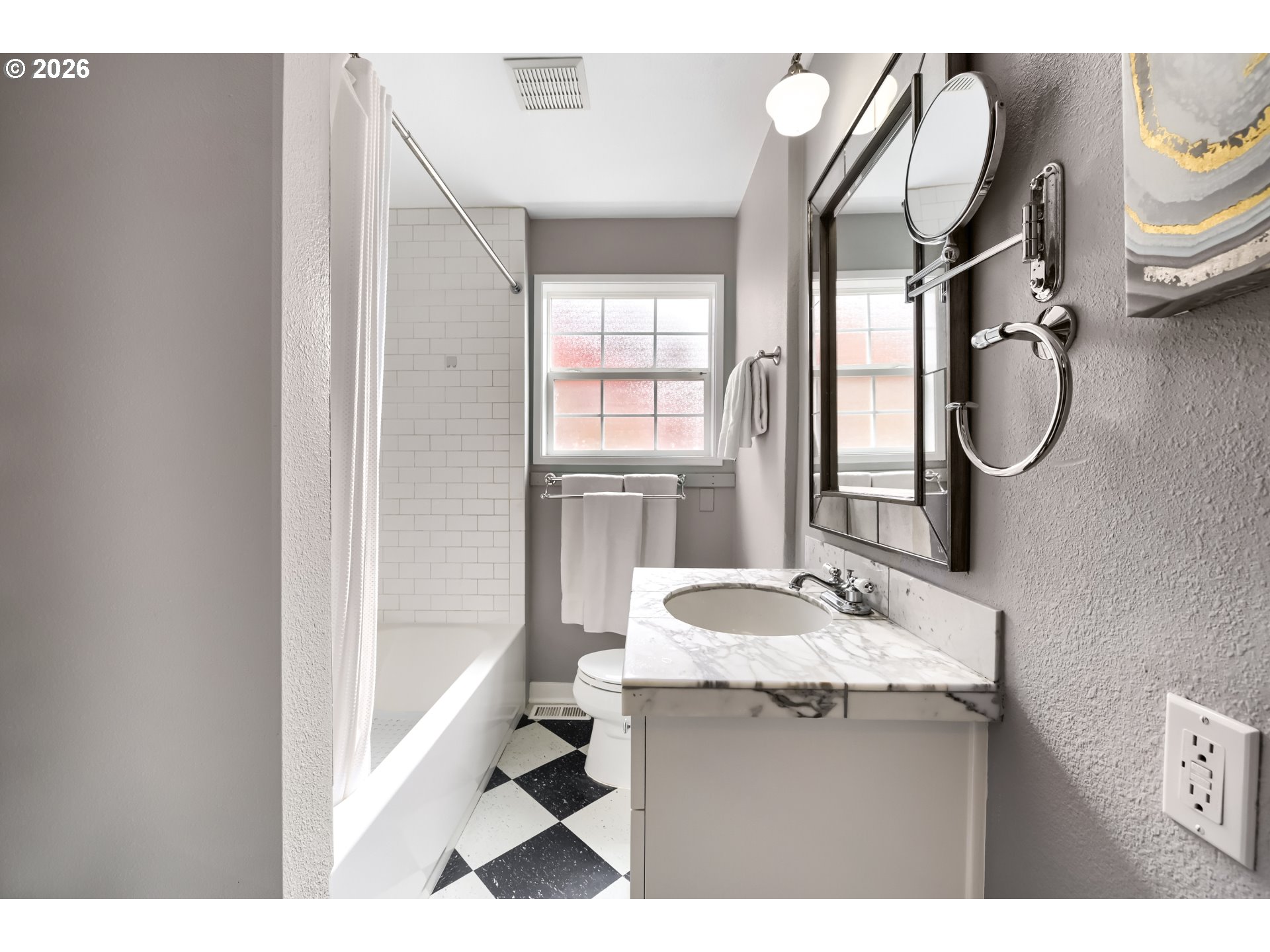 5812 Southeast Bush Street Portland, OR 97206 - Photo 22 of 27 a bathroom with a granite countertop sink a mirror and a bathtub