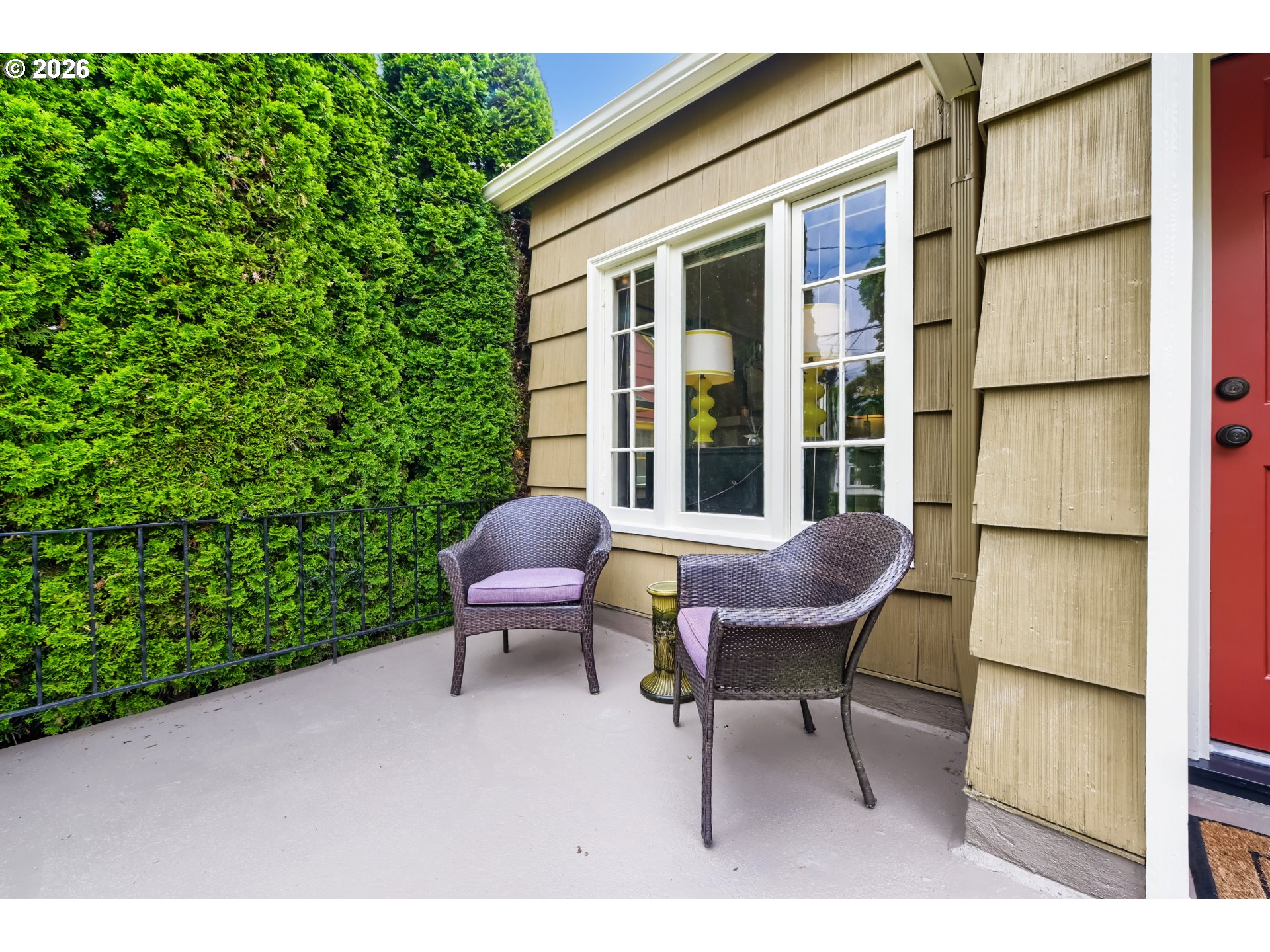 5812 Southeast Bush Street Portland, OR 97206 - Photo 5 of 27 a view of a chair and table in backyard of the house