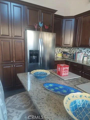 a kitchen with refrigerator and countertop