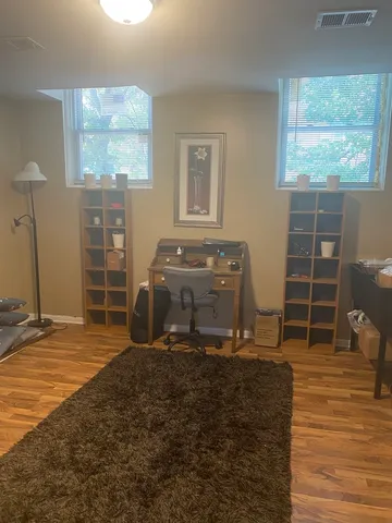 a white toilet sitting next to a bath tub