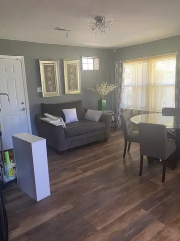 a kitchen with a table and chairs