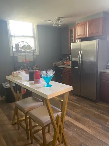 a kitchen with granite countertop a sink cabinets and window