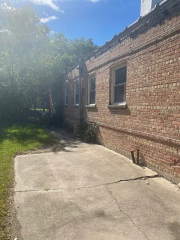 a view of a two chairs in the patio