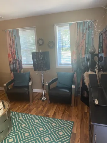 a living room with furniture and a window