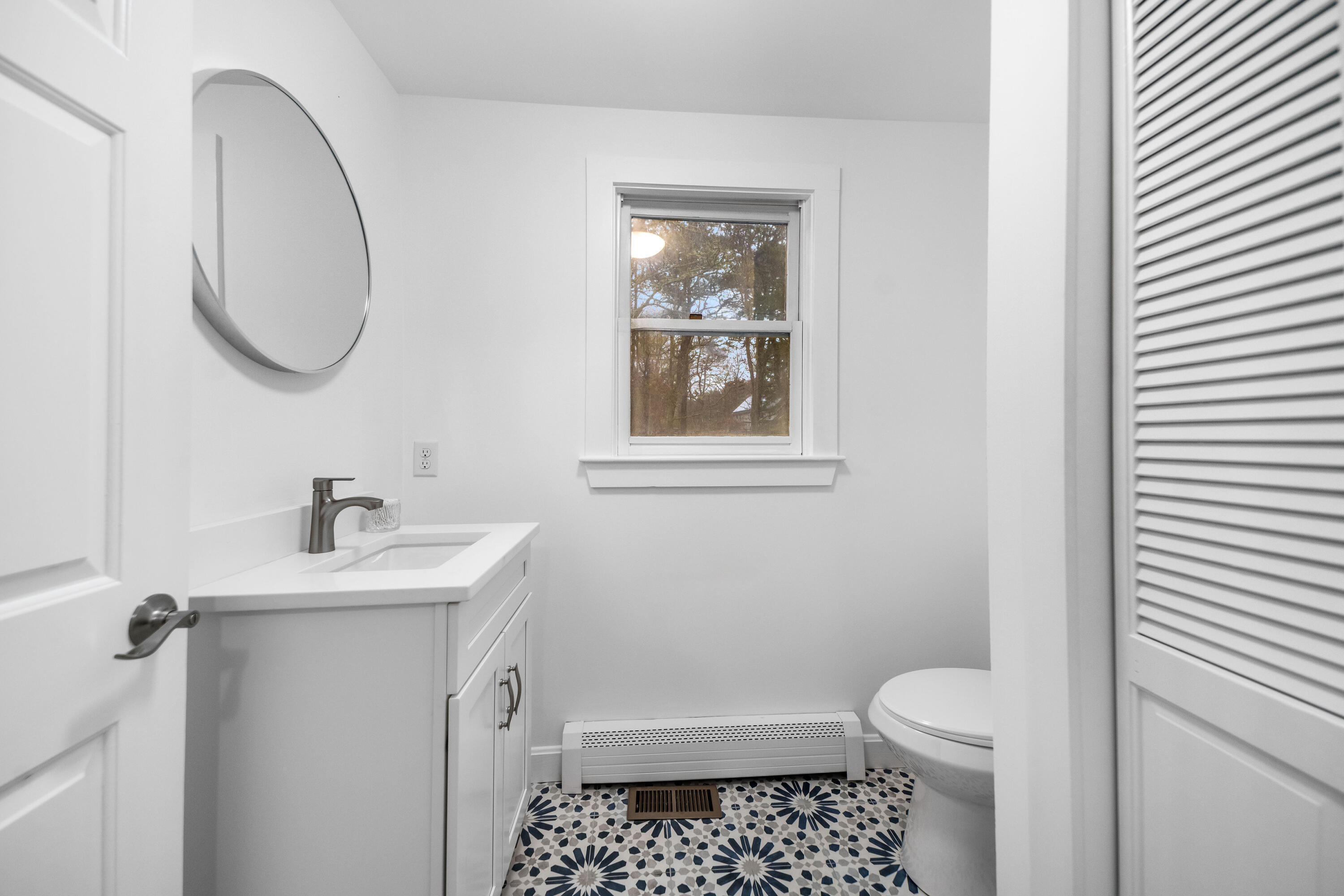3 Sheayer Road Harwich, MA 02645 - Photo 15 of 38 a bathroom with a sink a toilet and a mirror