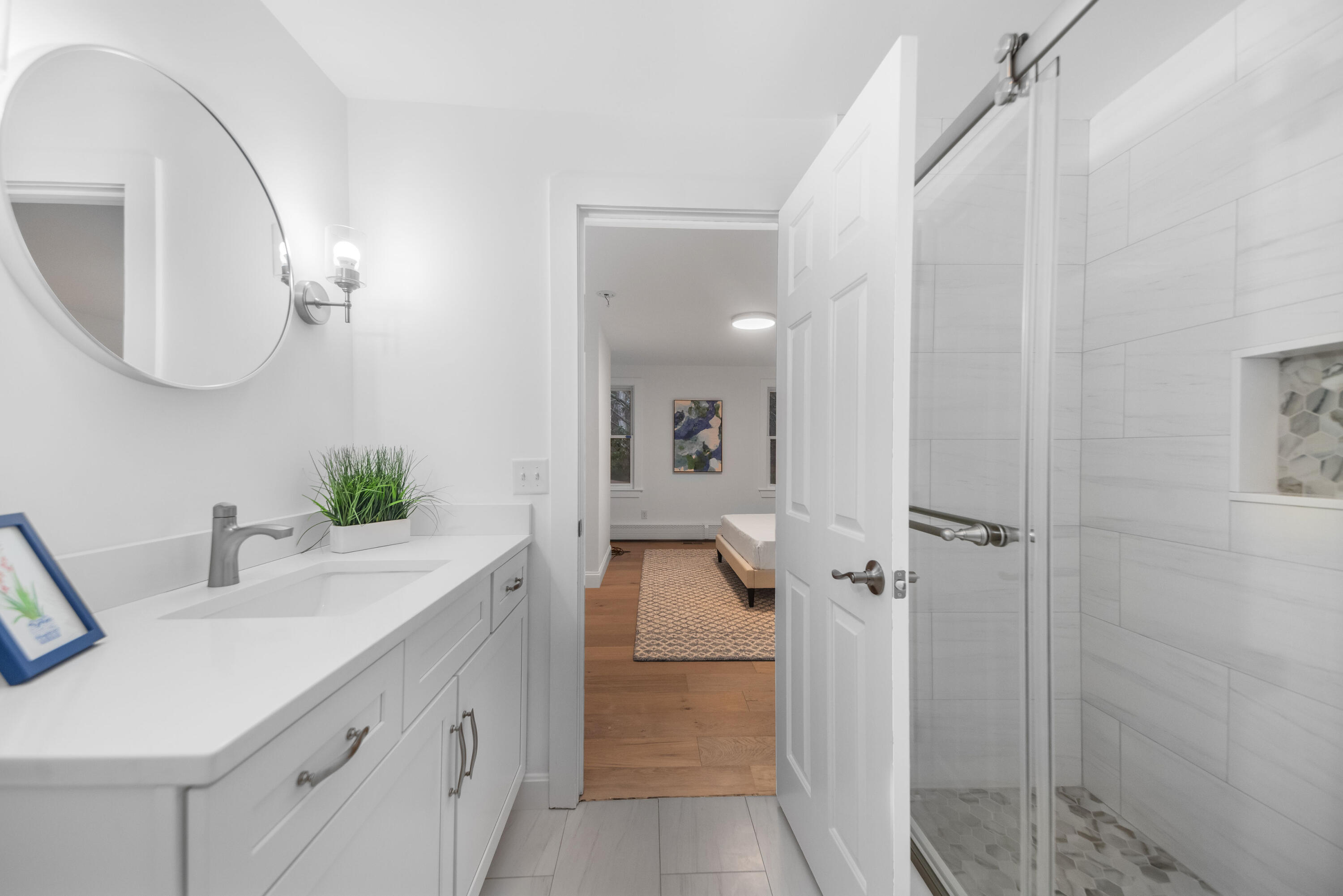 3 Sheayer Road Harwich, MA 02645 - Photo 18 of 38 a bathroom with a double vanity sink a toilet a mirror and shower