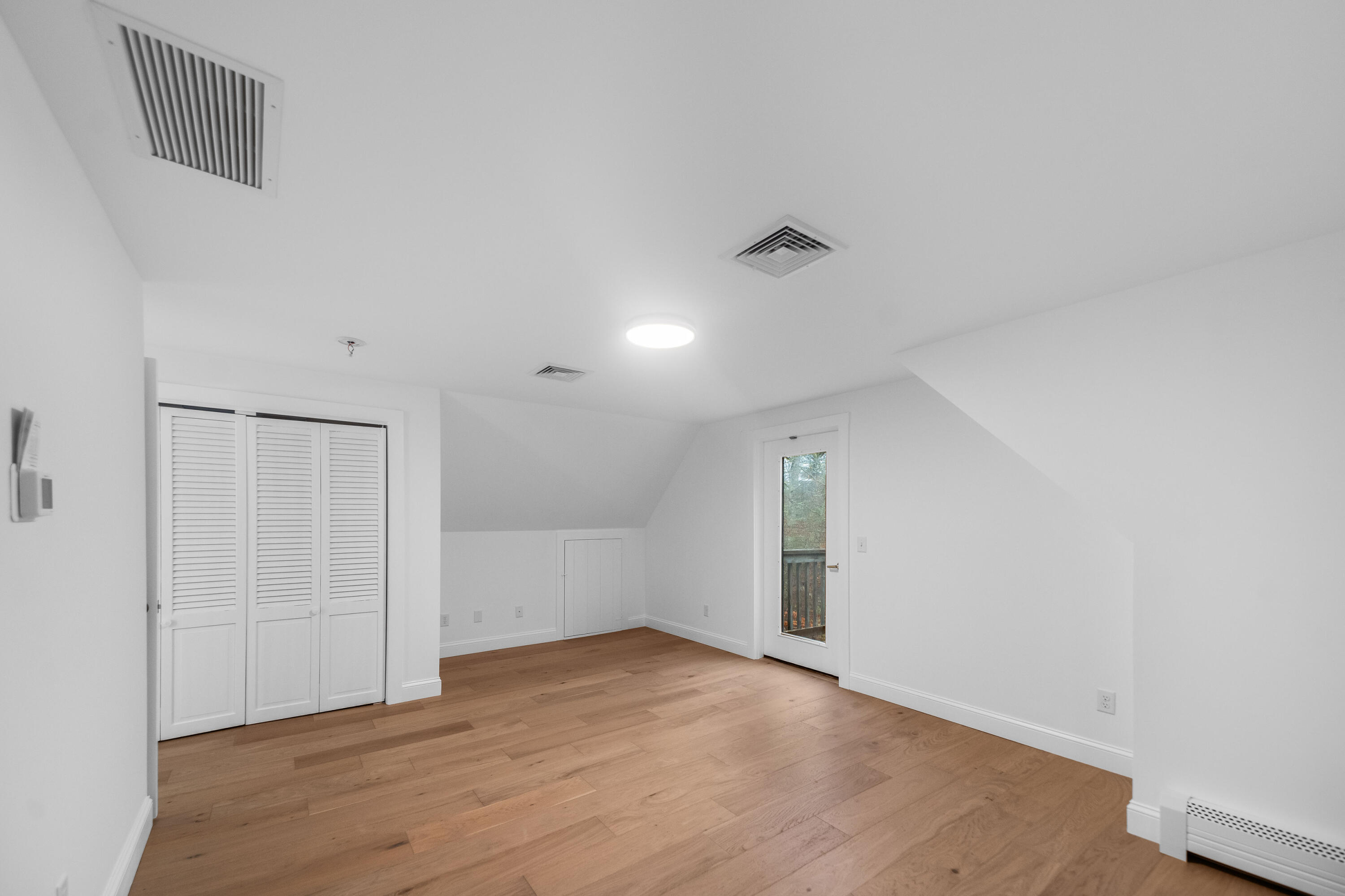 3 Sheayer Road Harwich, MA 02645 - Photo 22 of 38 a view of an empty room with wooden floor and closet