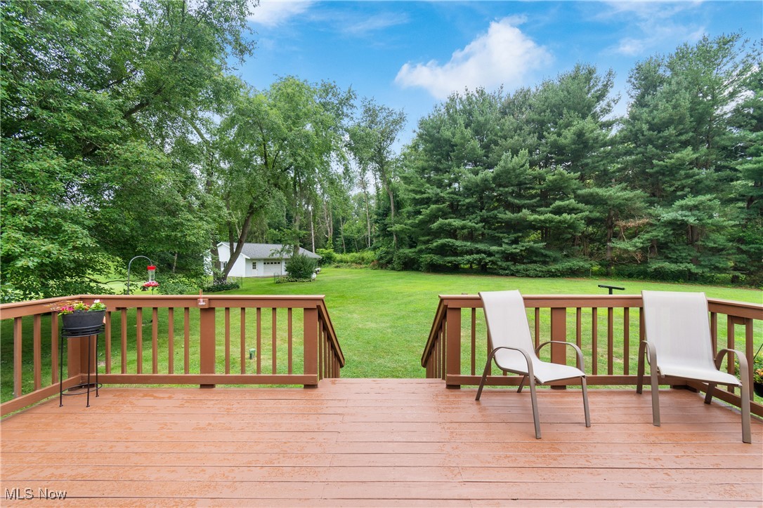 2560 Rutt Court Wooster, OH 44691 - Photo 24 of 33 Wooden deck featuring a lawn and view of wooded area