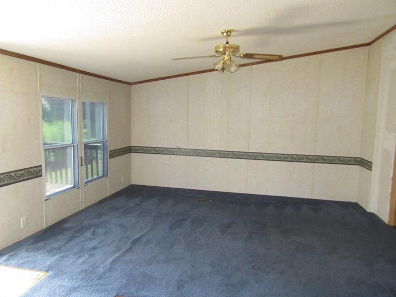 2153 Broome Road Palmyra, TN 37142 - Photo 3 of 10 a view of an empty room with a window