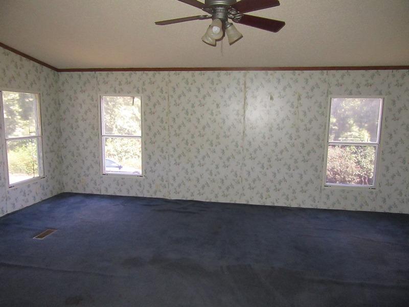 2153 Broome Road Palmyra, TN 37142 - Photo 7 of 10 an empty room with a window