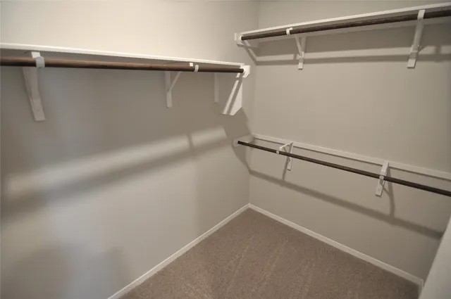 a kitchen with stainless steel appliances granite countertop a stove a refrigerator and a microwave