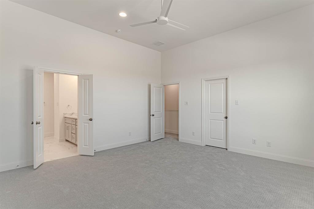 2136 Village Walk Lane Aledo, TX 76008 - Photo 23 of 38 Owner's suite with ensuite bath and walk in closet with custom shelving