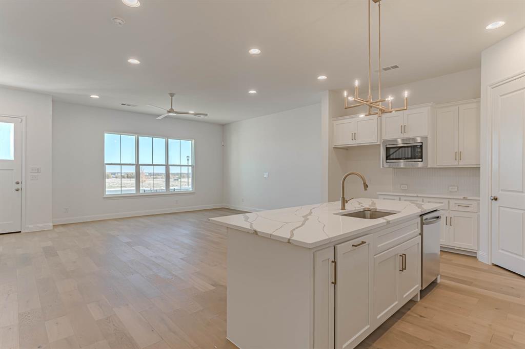 2136 Village Walk Lane Aledo, TX 76008 - Photo 5 of 38 Huge living area with wood flooring throughout first floor