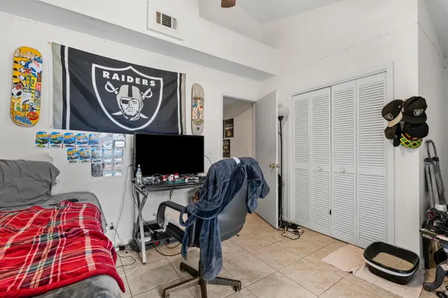 a room with furniture and musical instruments