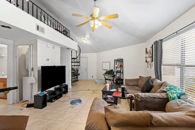 a living room with furniture and a large window