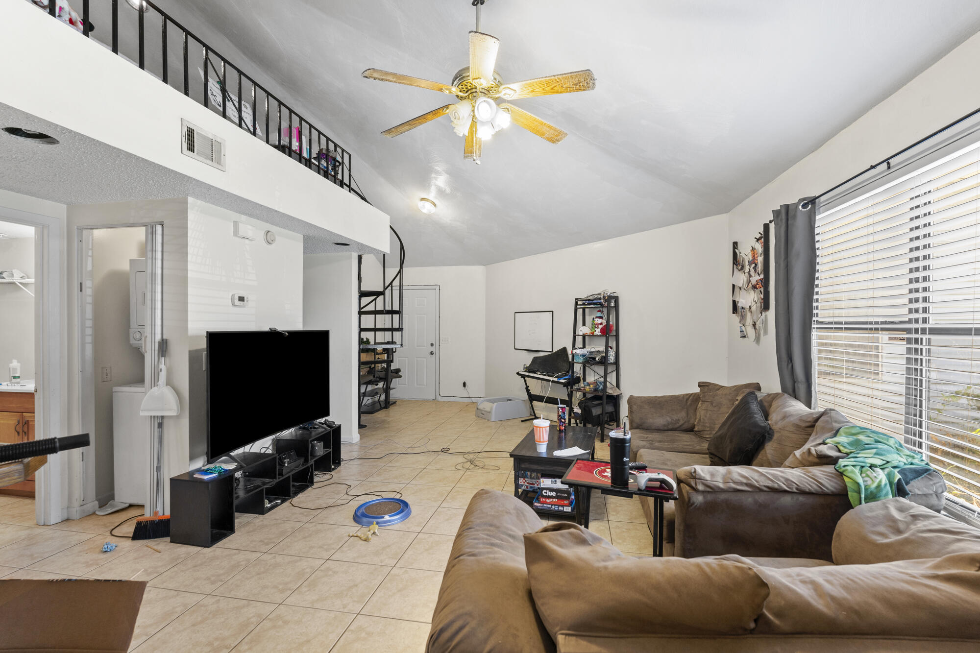 6904 Sea Turtle Circle Navarre, FL 32566 - Photo 23 of 49 a living room with furniture and a flat screen tv